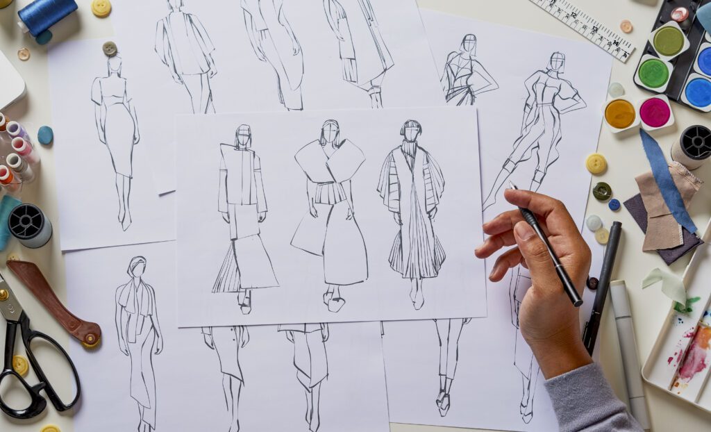 Fashion designer stylish drawings sketches textile fabric materi